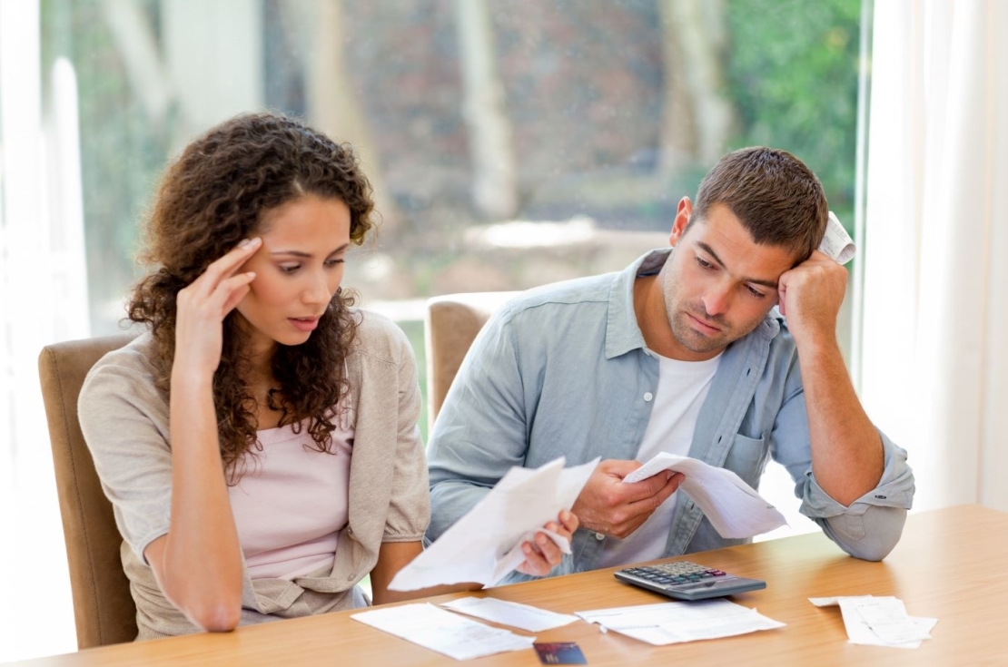 Concerned Couple Discussing Finances